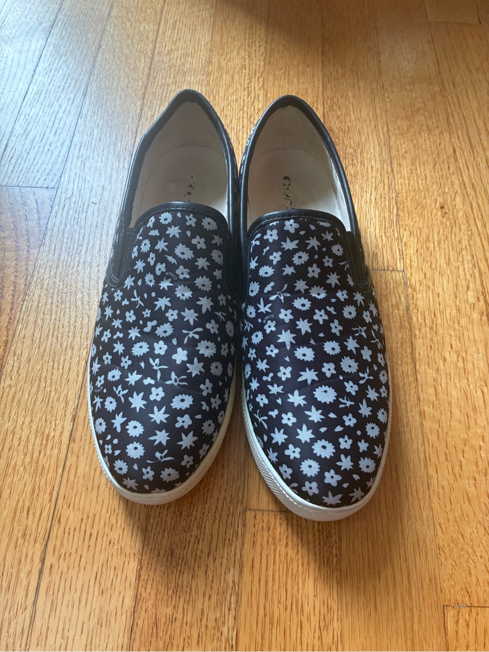 Coach black and white floral slip-on sneakers